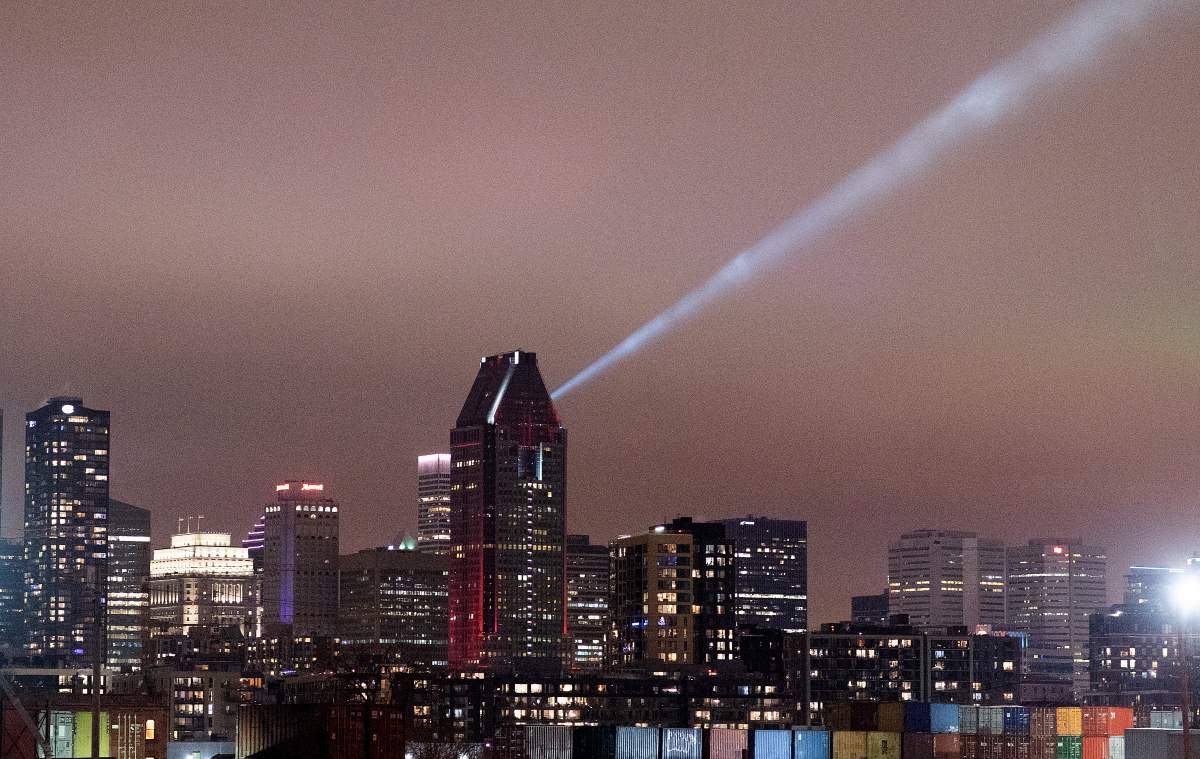 The Montreal skyline is shown shortly before curfew in Montreal, Sunday, January 10, 2021, as the COVID-19 pandemic continues in Canada and around the world. 