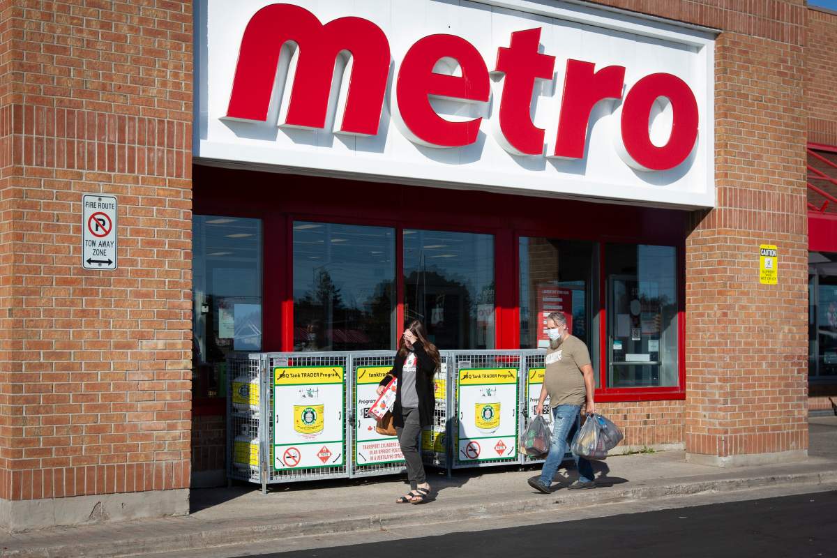 People wear masks as they leave a Metro grocery store in Kingston, Ontario on Friday, Sept. 11, 2020.  File photo.