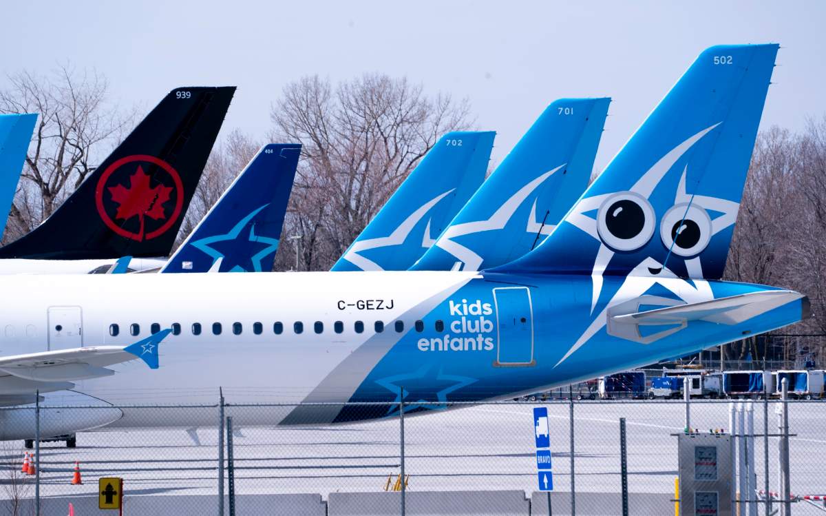 Air Transat and an Air Canada aircrafts are seen on the tarmac at Montreal-Trudeau International Airport in Montreal, on Wednesday, April 8, 2020.