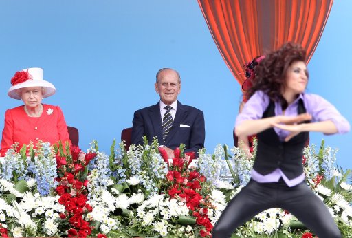 Queen Elizabeth II and Prince Philip, Duke of Edinburgh watch a dancer perform during Canada Day celebrations on Parliament Hill on July 1, 2010 in Ottawa, Canada.