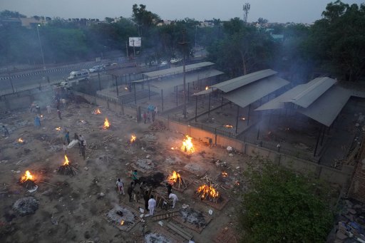 A view of a crematorium ground showing funeral pyres during a mass cremation of victims, who died due to the coronavirus disease (COVID-19), at a crematorium in New Delhi on April 22, 2021.