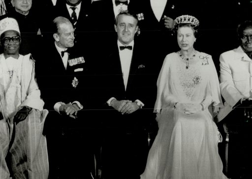 Prime Minister Brian Mulroney is flanked by the Queen and Prince Philip while posing for a group photo in Vancouver before the royal couple hosted a dinner for Commonwealth leaders.