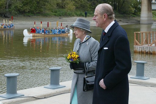 Queen Elizabeth II and the Duke of Edinburgh view ceremonies along the Red River in 2002 in Winnipeg on her 20th trip to Canada, the last stop of a year-long jubilee tour celebrating her 50-year reign.