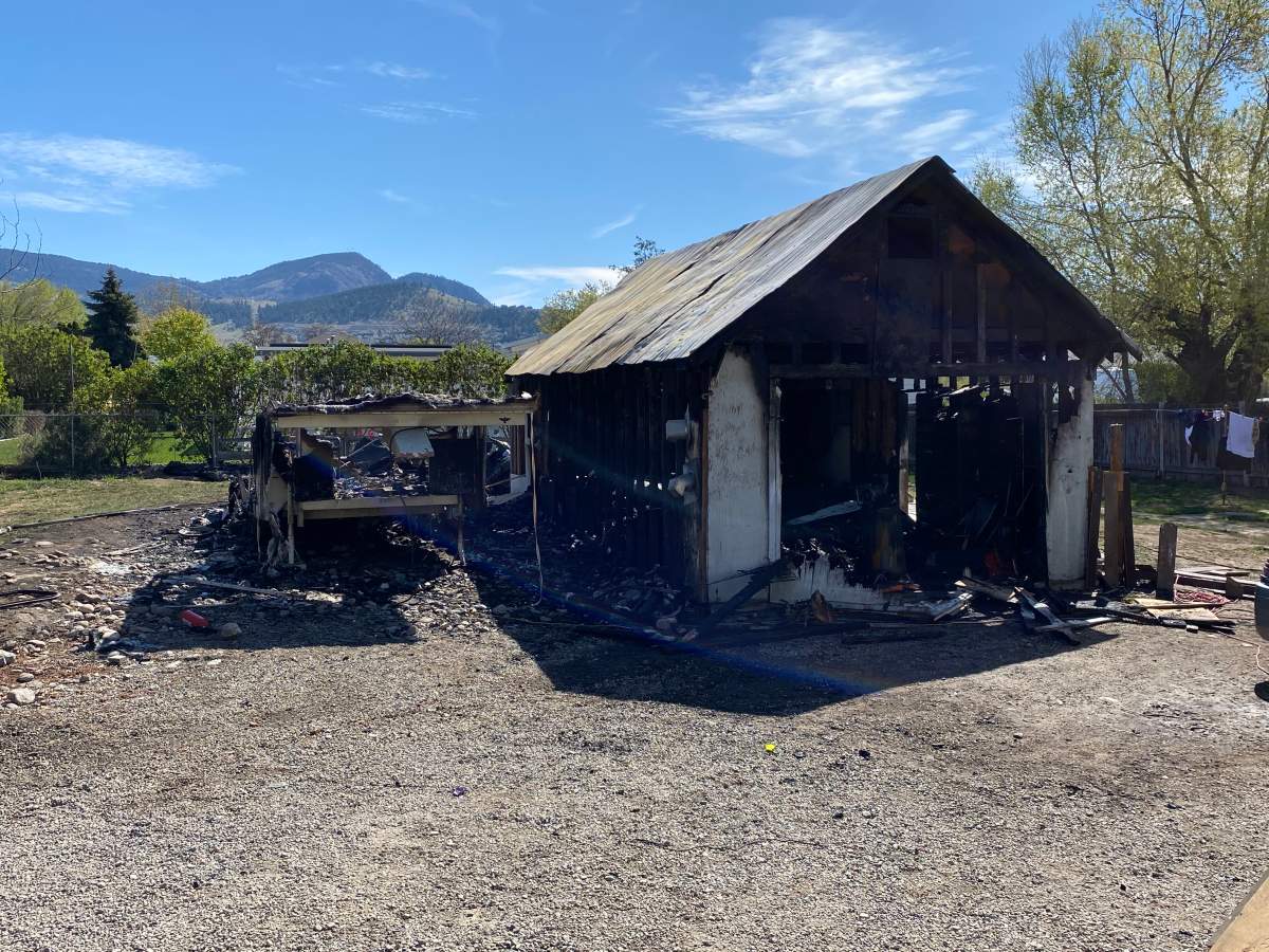 A trailer and garage were severely damaged by fire Friday morning. 