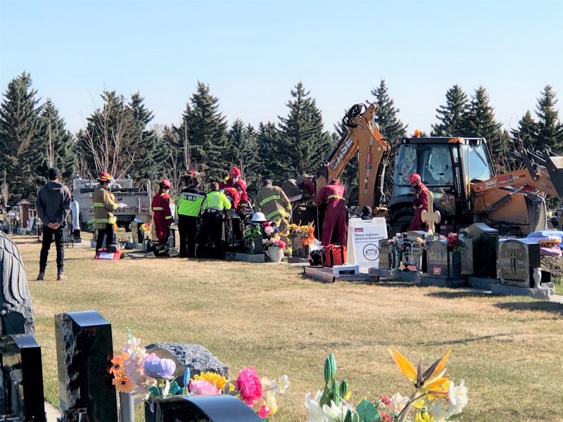Emergency crews respond to Queen’s Park Cemetery in northwest Calgary on Monday, April 26, 2021.