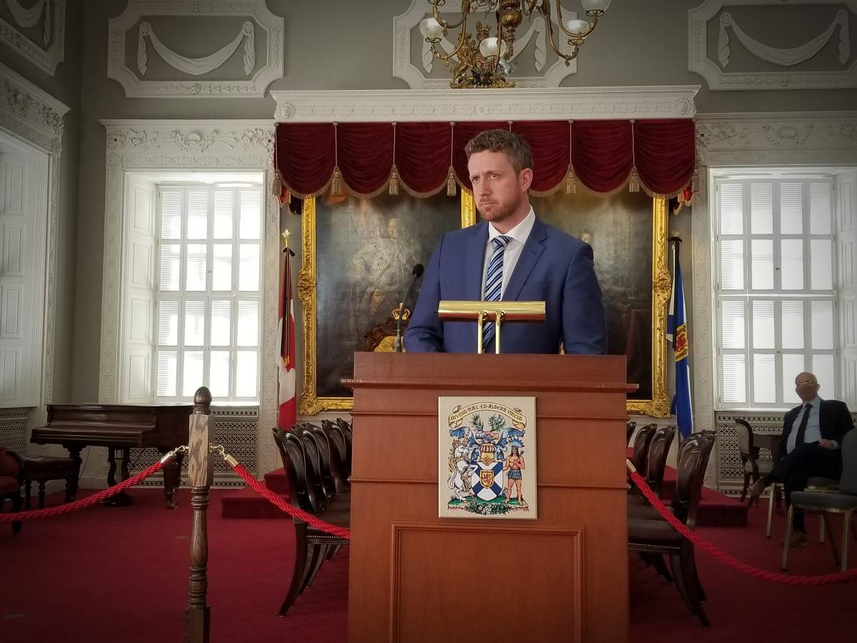 Nova Scotia Premier Iain Rankin speaks with reporters at Province House in Halifax on April 15, 2021.