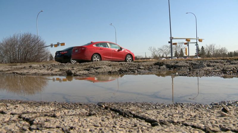 A large pothole can be seen in a Calgary road on April 6, 2021.