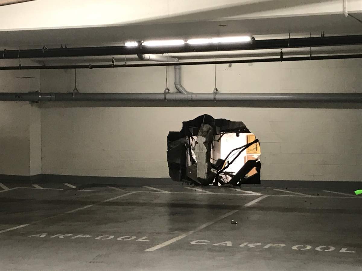 A hole in the parkade wall where a vehicle smashed through at Saanich’s Uptown Mall.