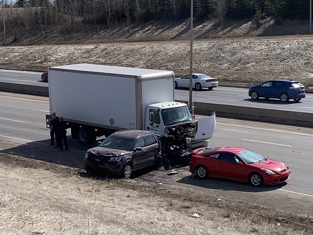 A major collision involving a police officer shut down a section of Whitemud Drive near 91 Street in southeast Edmonton on Monday, April 5, 2021.