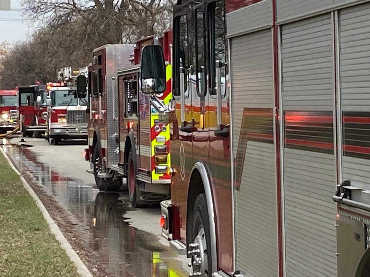 WFPS vehicles at the scene of a house fire.