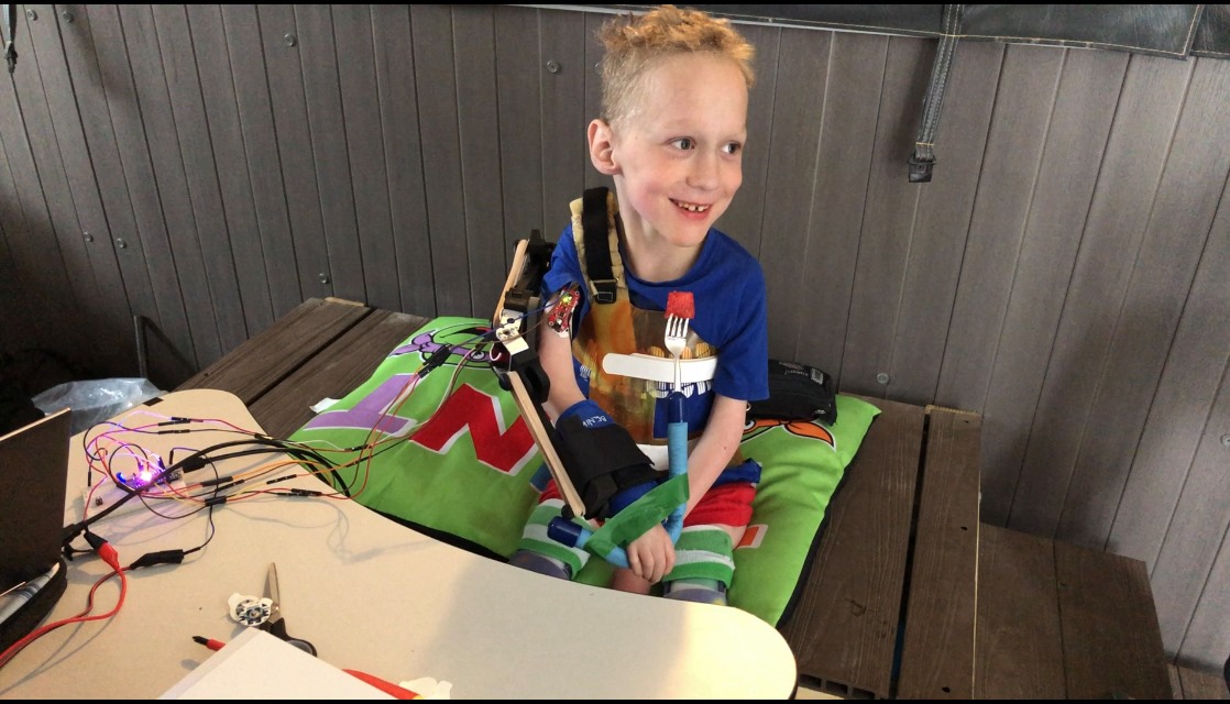 Reid eating watermelon on his own.