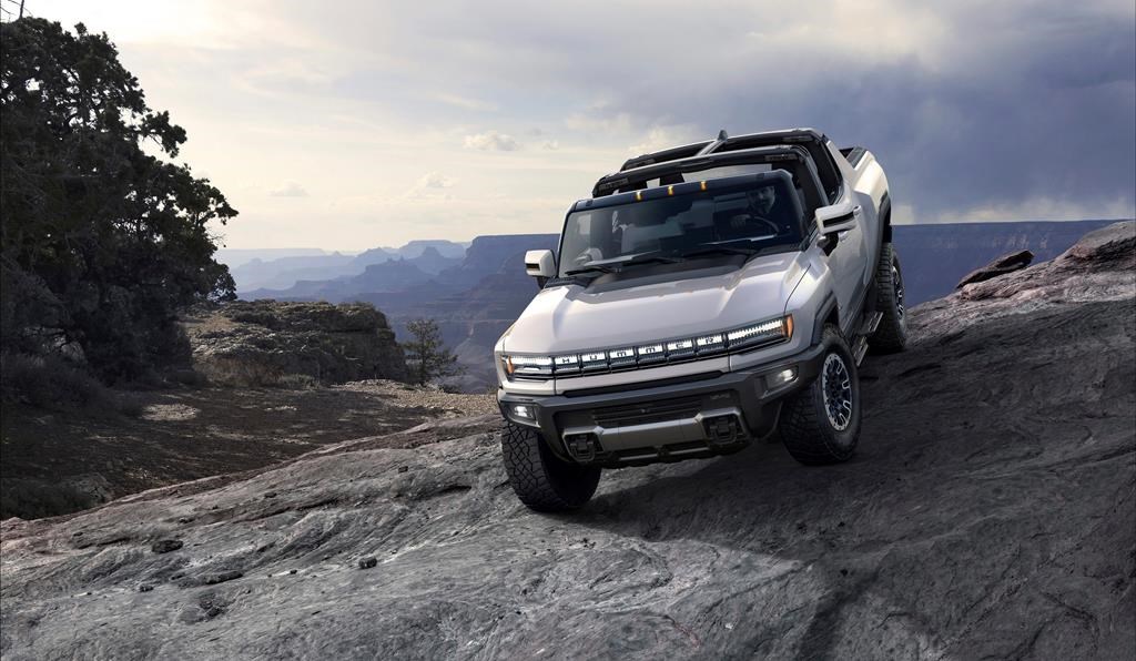 This photo provided by GMC shows the GMC Hummer EV, an electric pickup which will relaunch the Hummer brand.  (Courtesy of GMC via AP)