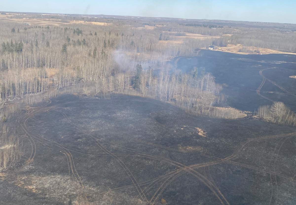 A wildfire in Parkland County, west of Edmonton, burned about 50 hectares of land on Wednesday, April 14, 2021.