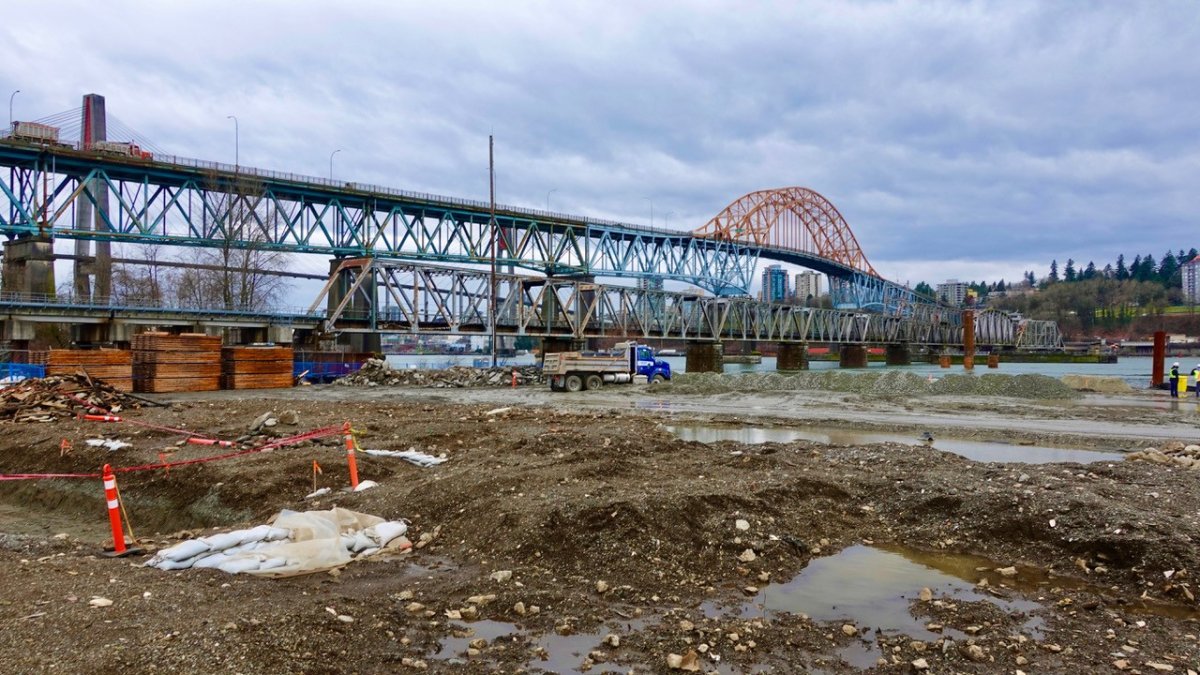 Work has started on the new Pattullo Bridge while the old Pattullo Bridge can be seen in the background.