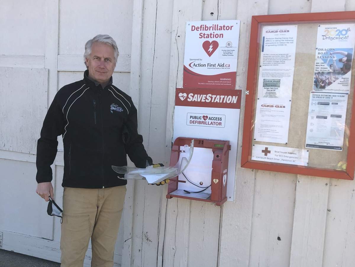 Don Mulhall, coach and race director for the Penticton Dragon Boat Festival, shows the vandalism and theft of an AED at the Skaha Lake boathouse. 