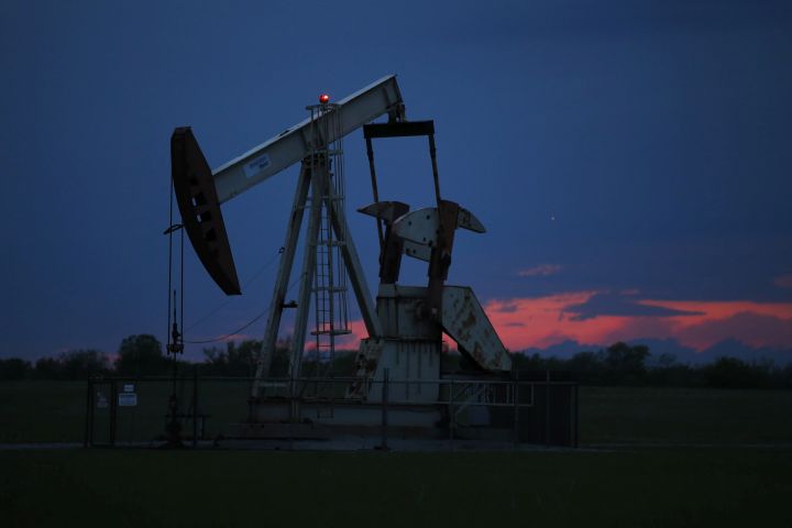 In this April 21, 2020 file photo, a pumpjack is pictured as the sun sets Tuesday, April 21, 2020, in Oklahoma City. 