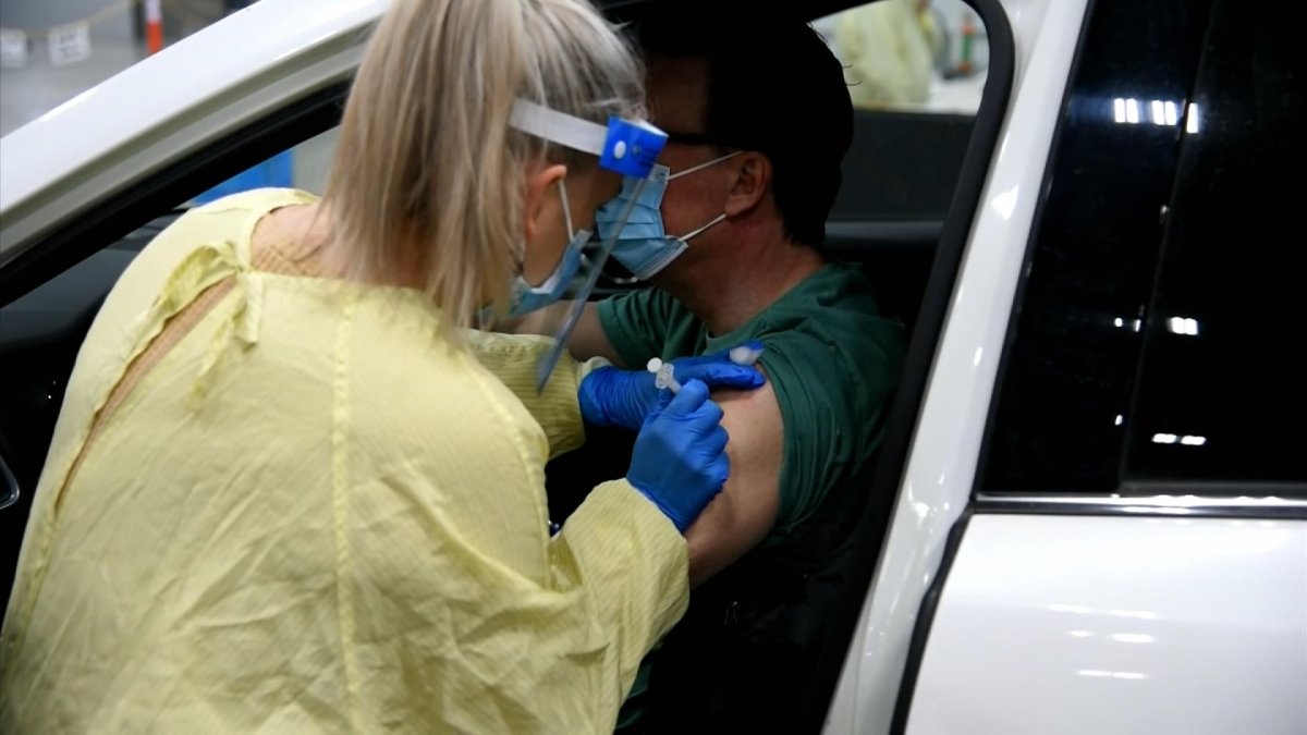 The drive-thru clinic in Regina moves to vaccinate residents ages 53 and 54 only, while the booking system eligibility moves to ages 55 and over provincewide.