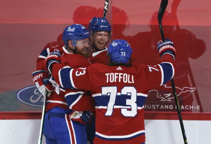 Montreal Canadiens’ Eric Staal, centre, celebrates his winning goal with teammates Jeff Petry, left, and Tyler Toffoli during overtime in NHL hockey action against the Edmonton Oilers, in Montreal on Monday, April 5, 2021.