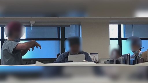 A closeup from a picture taken by a KGH patient of people at a nurses’ station not wearing masks. Global News has blurred the individuals’ faces.