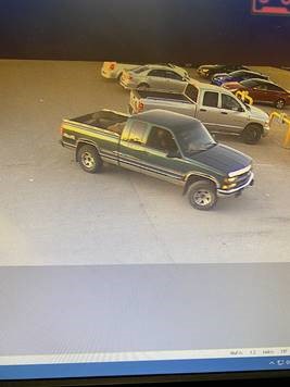 A photo of the suspect video, described as a green GMC Sierra or Chevrolet Silverado.