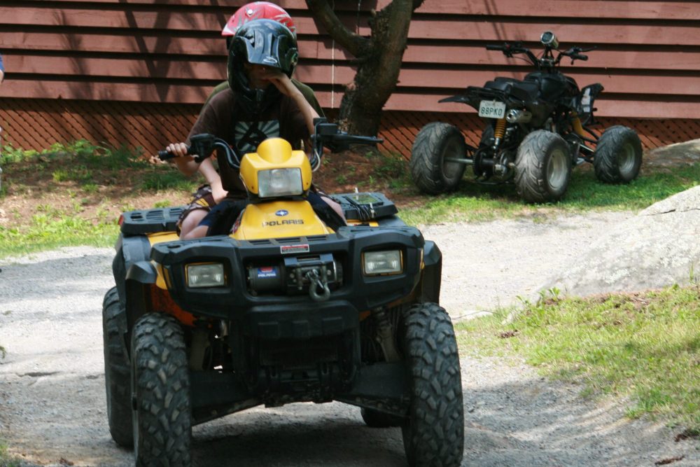 A teenager rides an ATV in this Aug. 3, 2009 file photo.