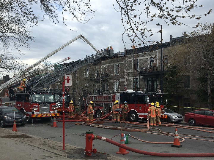 Montreal firefighters were at the scene of a four-alarm fire on de Lorimier Avenue on Wednesday afternoon. April 14, 2021. 