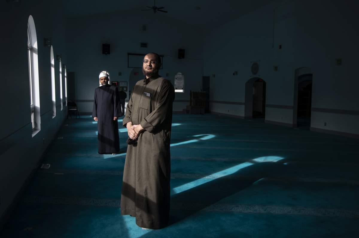 Vice-president of MCE Mosque Jamal Osman, front, and Imam Sherif ElSayed pose in Edmonton on Wednesday, March 31, 2021.  THE CANADIAN PRESS/Jason Franson.
