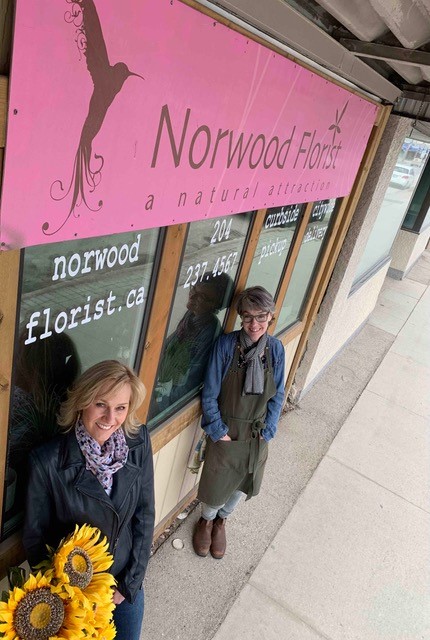 World Trade Centre Winnipeg president and CEO Mariette Mulaire, left, and Michele Pitre, owner of Norwood Florist Design Studio.