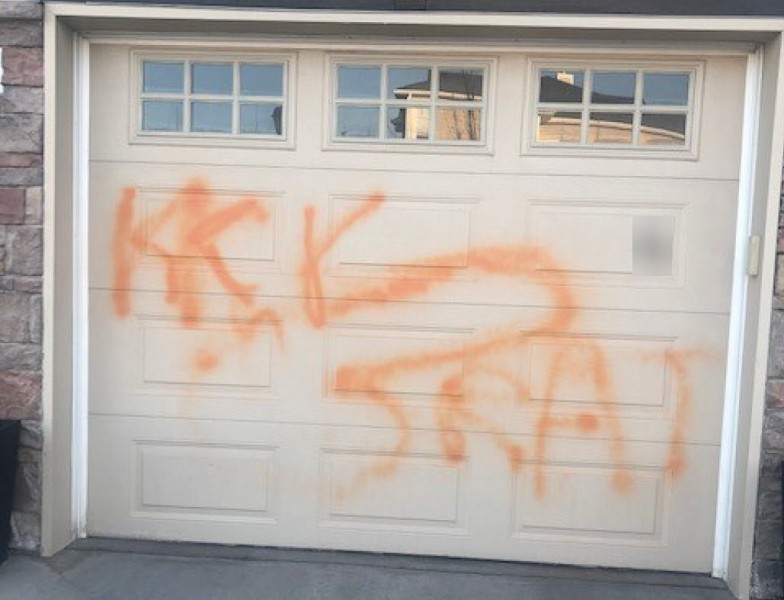 Graffiti seen on the garage door of a home in northwest Calgary. 