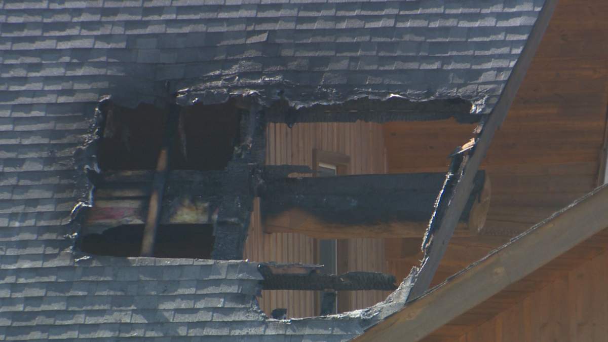 Home badly damaged after grass fire rips through the acreage.