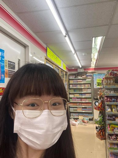 Jejene Narumpa poses in front of a giant lizard in a supermarket in Thailand, in this image posted online April 6, 2021.