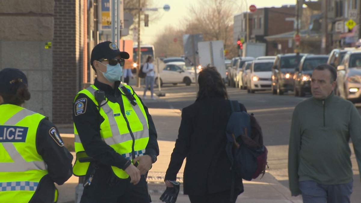 Montreal Police hand out pamphlets and issue warnings targeting reckless behaviour. 