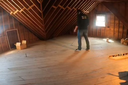 Keith Wille searches for hidden cash in the attic of a Massachusetts home.