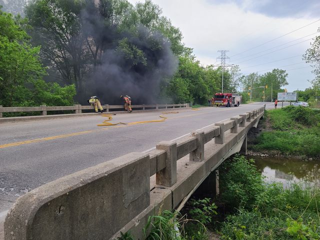 Smoke could be seen on a bridge on River Road near Veterans Memorial Parkway Sunday evening.