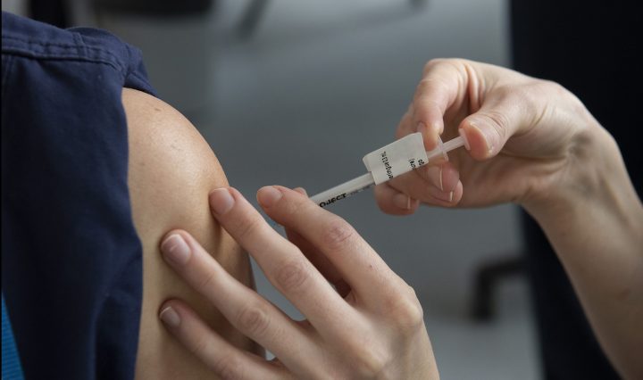 Individual receiving a COVID-19 vaccine