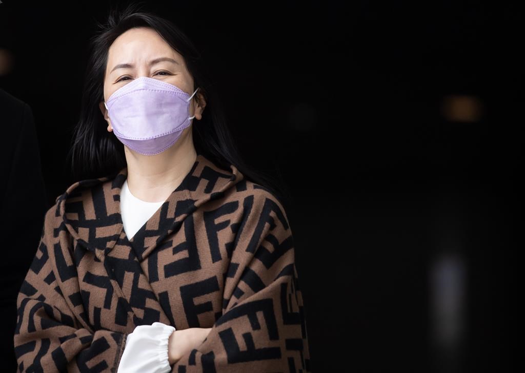 Meng Wanzhou, chief financial officer of Huawei, returns to B.C. Supreme Court after a break from her extradition hearing, in Vancouver, B.C., Wednesday, March 31, 2021. THE CANADIAN PRESS/Darryl Dyck.