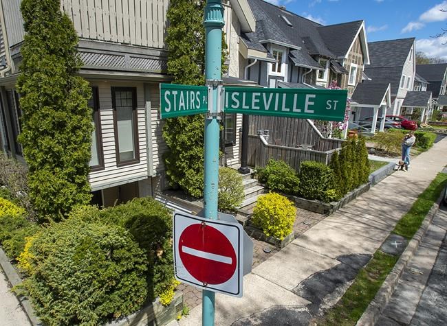 A sign marks Stairs Place in the Hydrostone district in the North end of Halifax on Thursday, May 13, 2021. The street was named for William Grant Stairs, a Canadian explorer from Halifax who helped lead some of the most controversial expeditions through the African continent. THE CANADIAN PRESS/Andrew Vaughan.