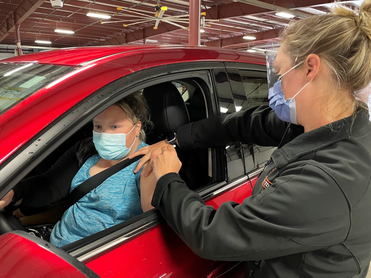 Katie Richardson, of Bethany, received the 25,000th dose of coronavirus vaccine administered to members of the community at Ross Memorial Hospital’s COVID-19 vaccination clinic at the Lindsay Exhibition from Lorah Otter, RPN at Ross Memorial, on May 28, 2021.