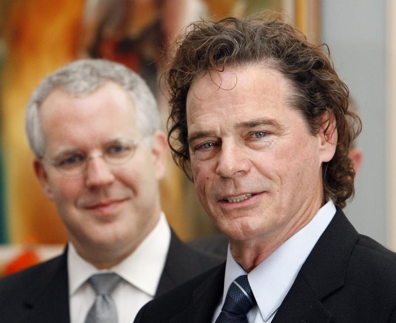 FILE - In this Wednesday, Feb. 21, 2007. file photo, Music artist B.J. Thomas speaks after Gov. Brad Henry, left, presented Thomas with a proclamation at the state Capitol in Oklahoma City. B.J. Thomas, the versatile, Grammy-winning singer who enjoyed success on the pop, country and gospel charts with such hits as “I Just Can’t Help Believing,” “Raindrops Keep Fallin’ On My Head” and “Hooked On a Feeling,” has died, Saturday, May 29, 2021. He was 78.