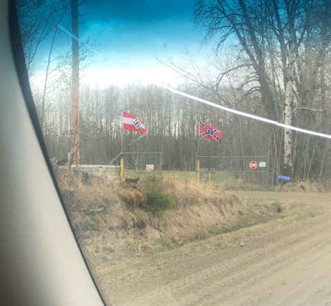 A Nazi Hitler Youth flag and an American Confederate flag flying at a rural property southwest of Edmonton near Breton, Alta. in May 2021.
