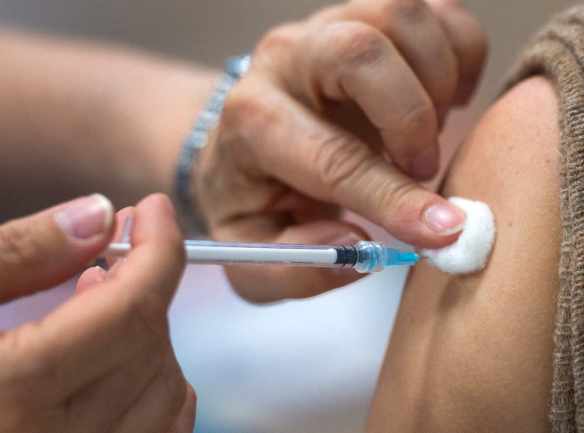 A person gets the Pfizer COVID-19 vaccination at a mobile clinic for members of First Nations and their partners, Friday, April 30, 2021 in Montreal.