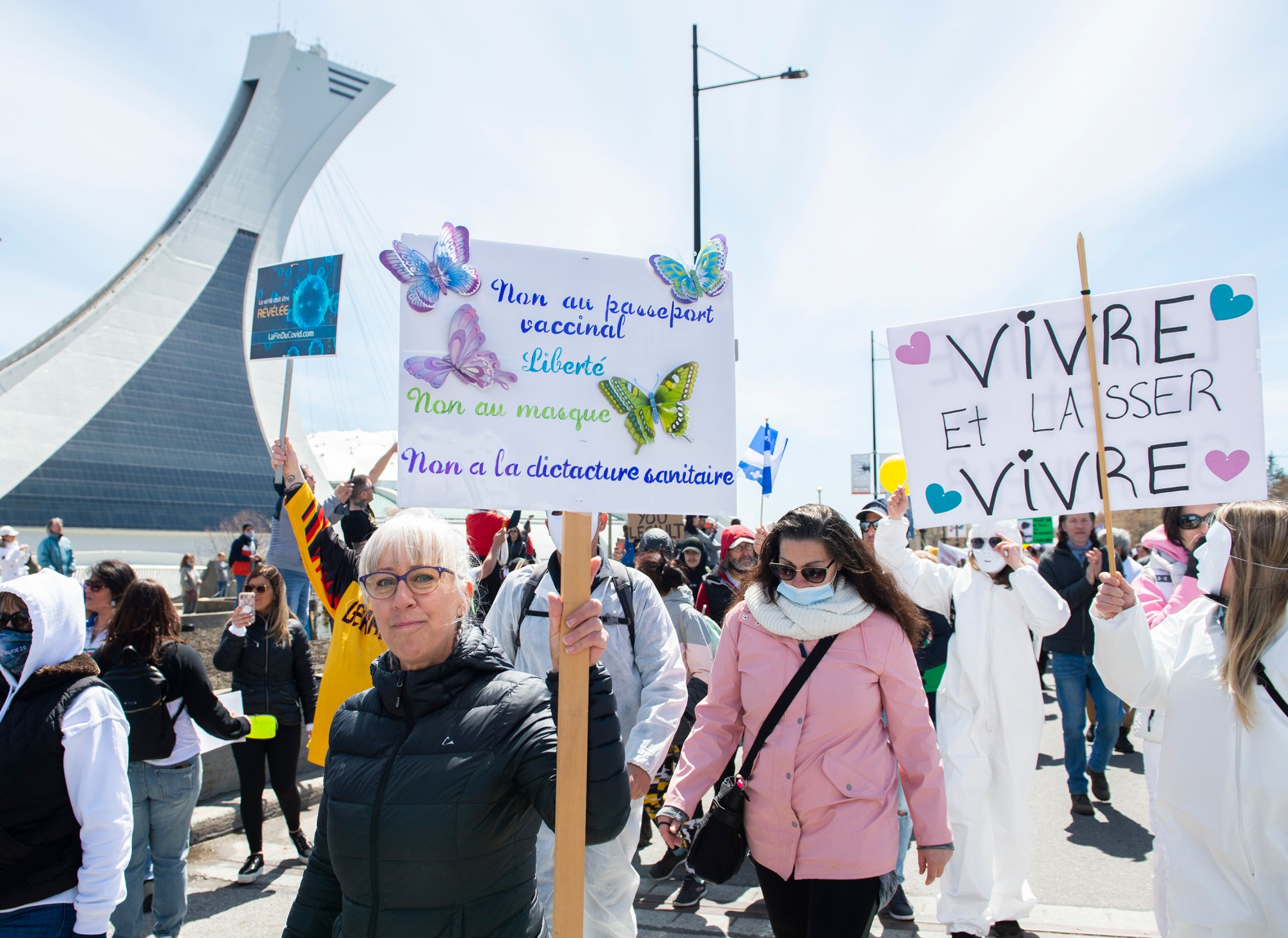 People take part in a demonstration opposing the Quebec government’s measures to help curb the spread of COVID-19 in Montreal, Saturday, May 1, 2021. 