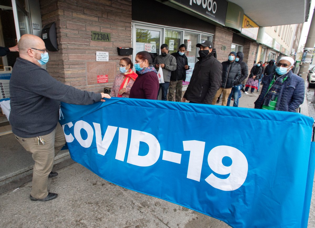 People line up for their shots at a walk-in mobile COVID-19 vaccination clinic at the Masjid Assuna mosque Wednesday, May 5, 2021  in Montreal. 