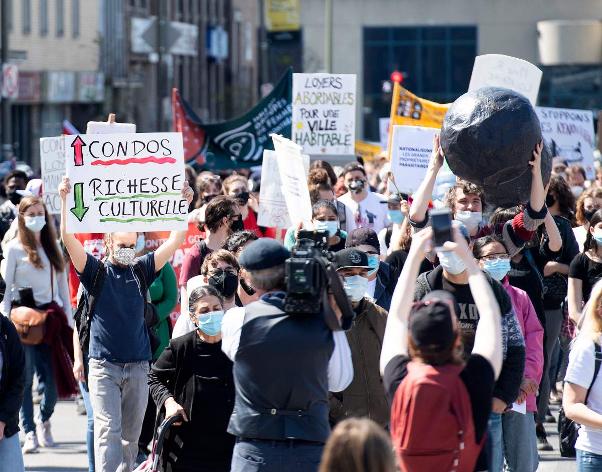 People take part in a demonstration calling for more social and affordable housing in Montreal, Saturday, April 24, 2021.