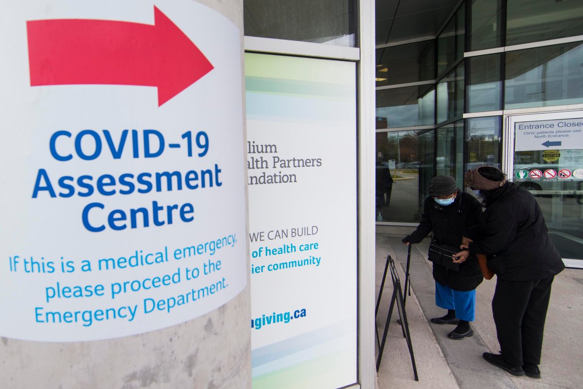MISSISSAUGA (CANADA), May 5, 2021  People wearing face masks line up for COVID-19 tests at a COVID-19 assessment center in Mississauga, Ontario, Canada, on May 5, 2021.