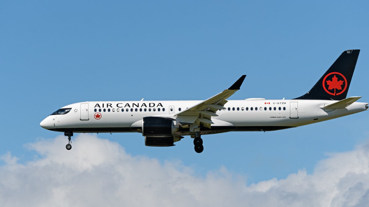 An Air Canada Airbus A220-300 jet airliner (C-GTZH) airborne on final approach for landing at Vancouver International Airport, Richmond, B.C. on Friday, May 7, 2021. 