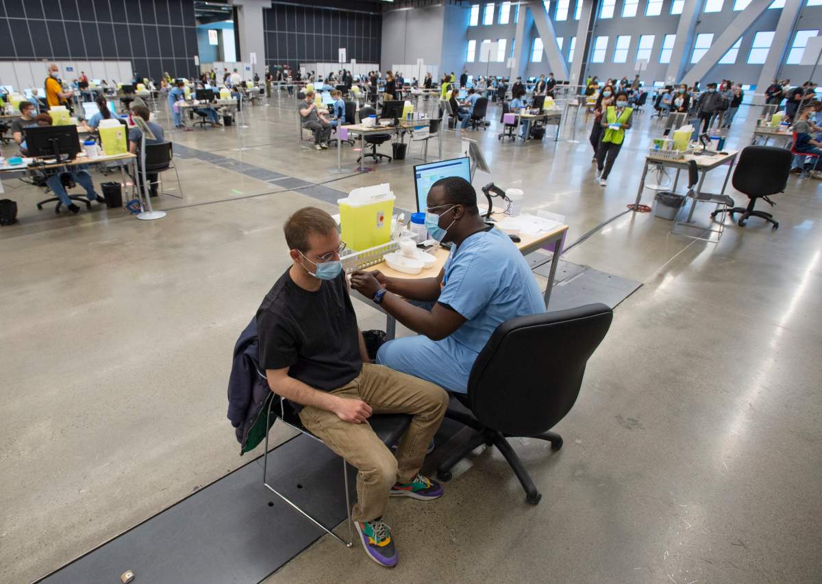 People get vaccinated at the Palais de Congress COVID-19 vaccination clinic, Thursday, May 13, 2021  in Montreal.