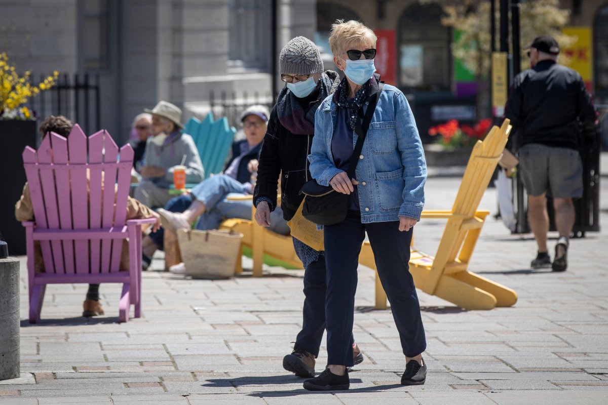 People wear surgical masks to protect them from the COVID-19 virus in Kingston, Ontario on Saturday May 15, 2021. 