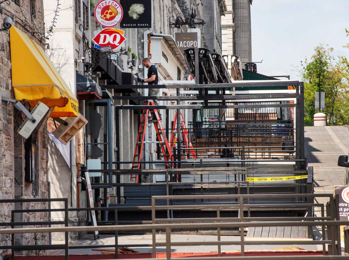 Terraces are prepared for the season on Place Jacques Cartier in Old Montreal, Tuesday, May 18, 2021 as restaurants expect an easing of COVID-19 restrictions.