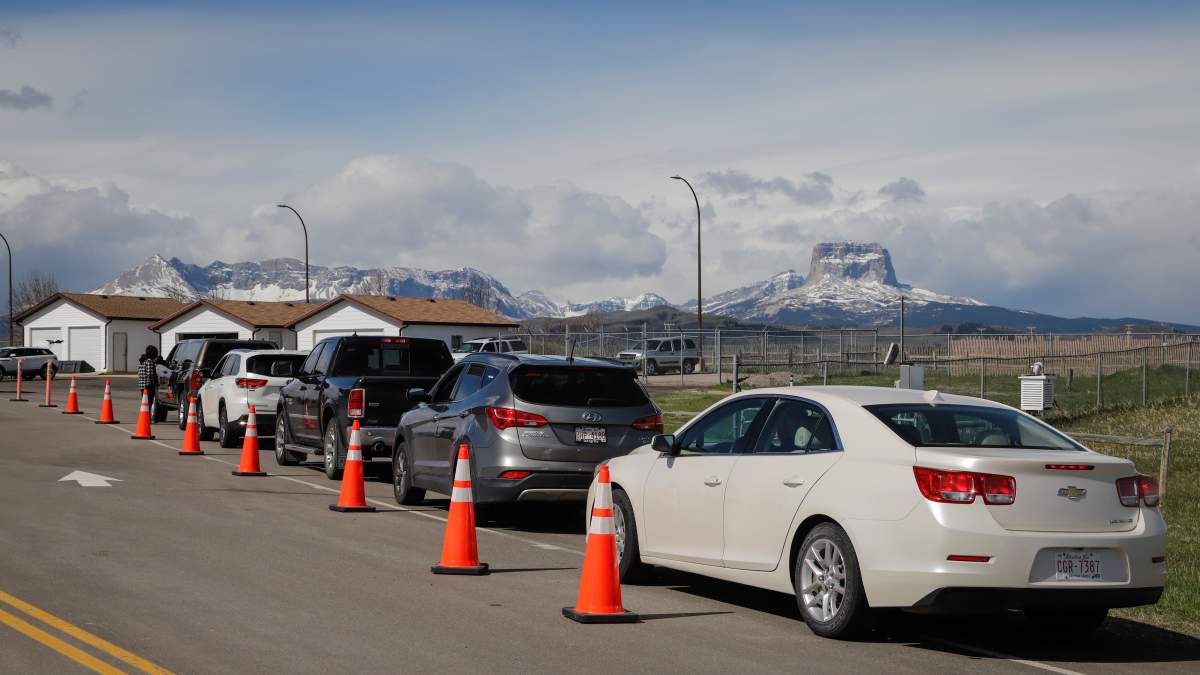 Southern Alberta residents lined up to get shots of a COVID-19 vaccine from a Montana tribe in Carway, Alta., Tuesday, May 18, 2021.
